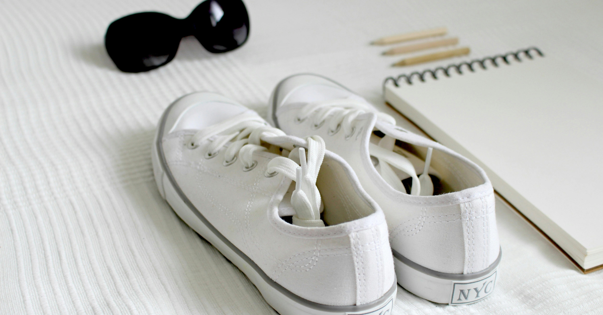 Stylish white sneakers for women paired with a casual outfit showing modern everyday sneaker fashion and versatile street style look