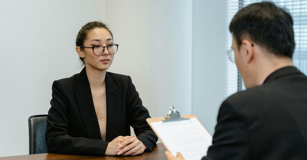 woman wearing professional interview outfit blazer business casual style 2026