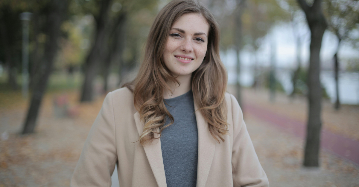 Elegant modest winter party outfit with long sleeve dress and stylish coat suitable for cold weather celebrations