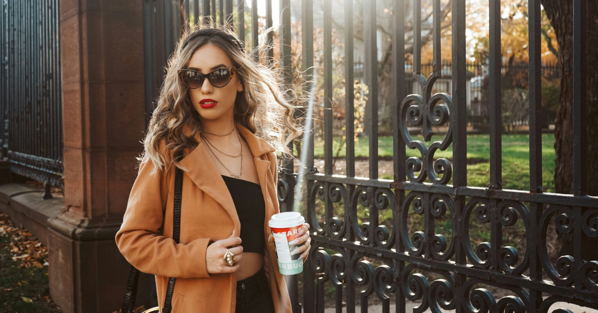 Old money inspired fall fashion outfit with a camel wool coat neutral knit sweater and tailored trousers styled in a timeless elegant look for fall 2026