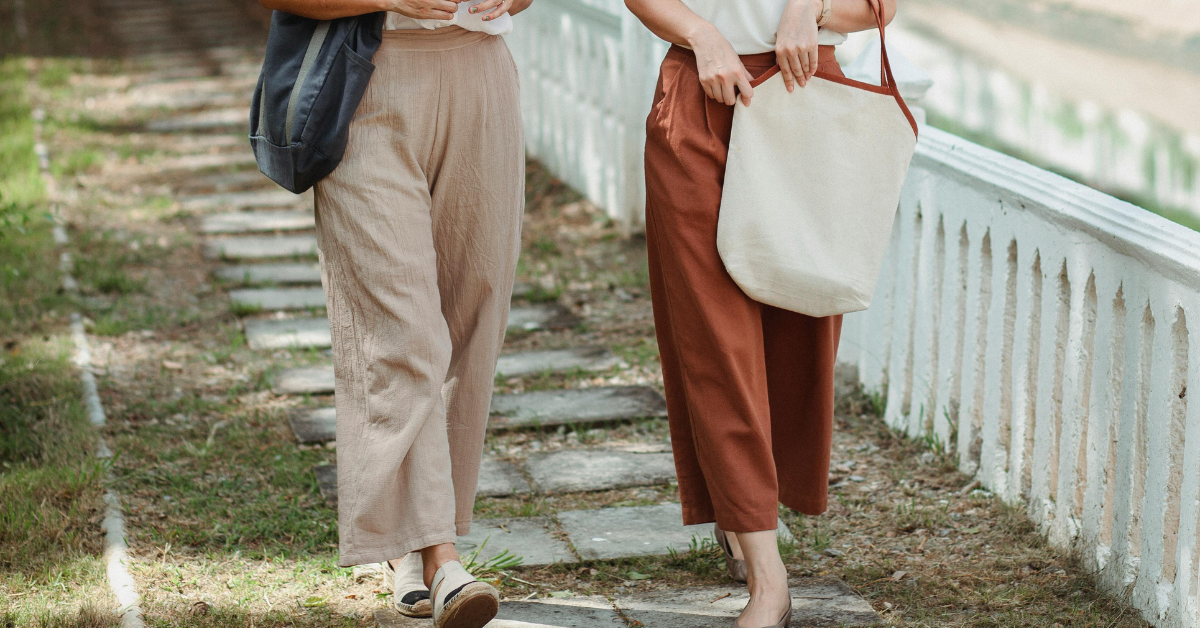 man wearing wide leg trousers styled with shirt and modern casual outfit