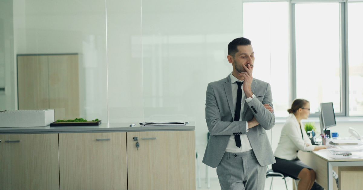 man wearing formal suit sitting in job interview
